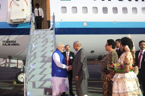 Modi being received on his arrival, at Nausori International Airport