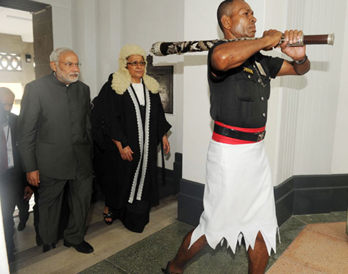 Modi being received on his arrival, at Nausori International Airport