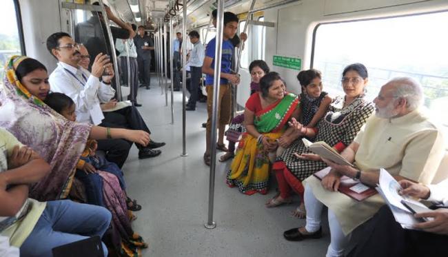 Narendra Modi travelling by the Delhi Metro
