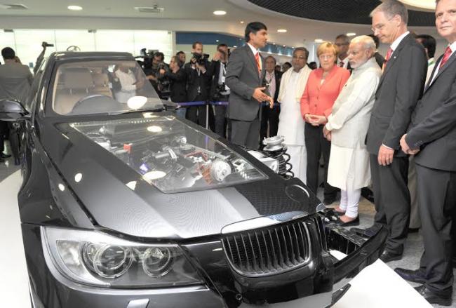 Narendra Modi and the German Chancellor, Dr. Angela Merkel visiting the Robert Bosch Engineering & Innovation Centre, in Bengaluru
