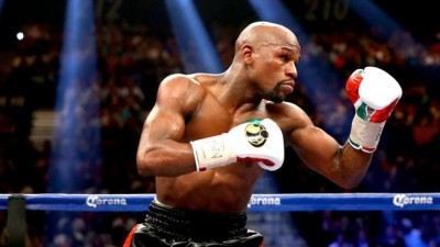 Floyd Mayweather undefeated, beats Pacquiao in richest boxing match