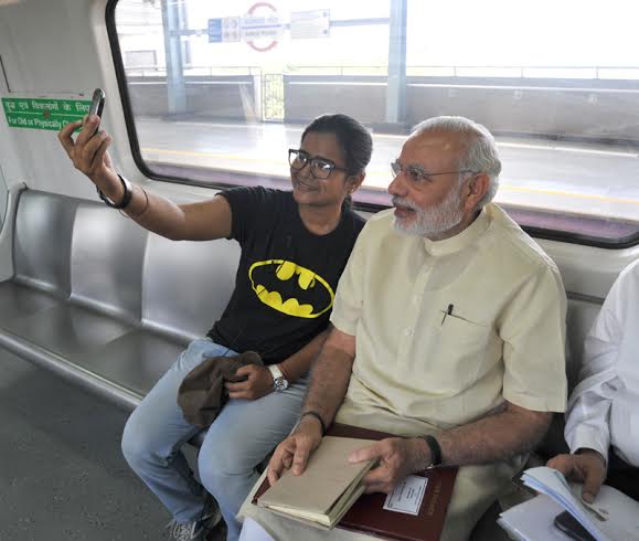 Narendra Modi travelling by the Delhi Metro