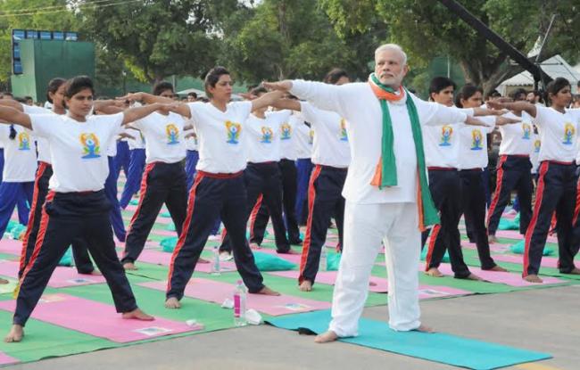 PM Modi leads mass yoga demonstration in Delhi on first International Yoga Day
