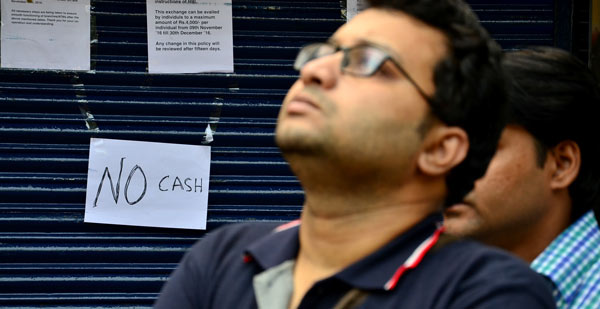 Kolkata: People queue in front of banks, ATMs to get cash