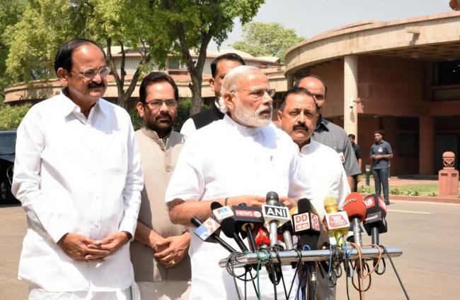  Narendra Modi delivering statement to the media outside the Parliament House