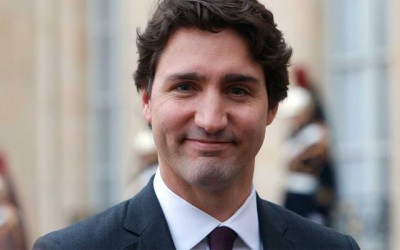 Canadaâ€™s Prime Minister Justin Trudeau hoists World AIDS Day flag