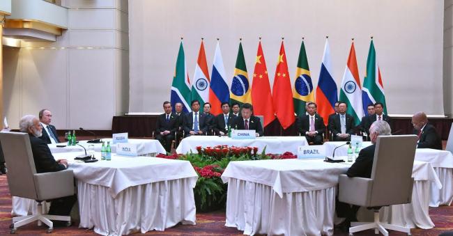 Narendra Modi being welcomed by the German Chancellor