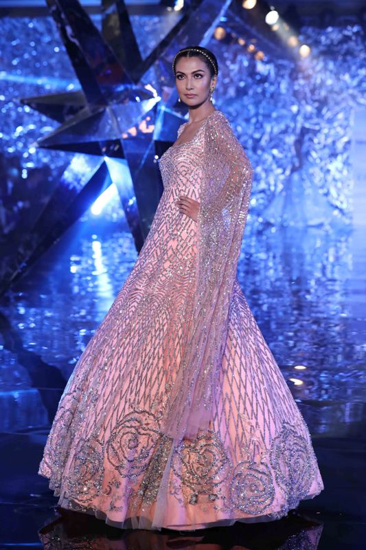 Models walk for Suneet Varma in India Couture Week