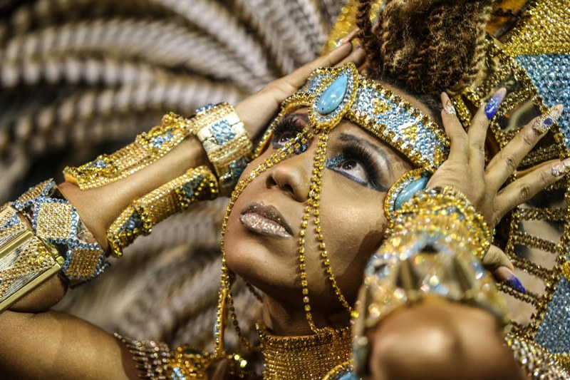 Samba school reveler performs in carnival parade