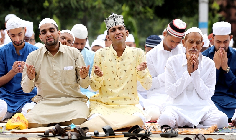Muslims offer prayers on Eid outside a Kolkata mosque