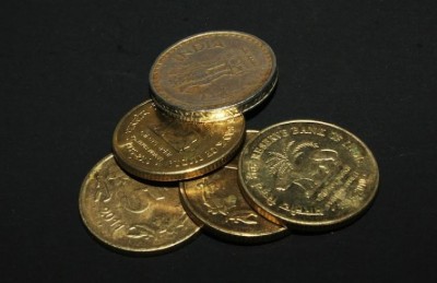 Polling staff perform uphill task of counting Rs 5 coins for security deposit