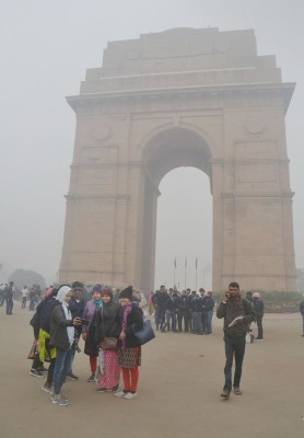 Visitors wrap themselves in warm clothes in New Delhi