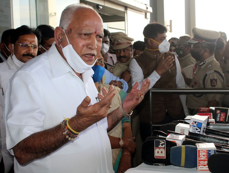 Karnataka CM B S Yeddyurappa speaks to media persons at Sambra Airport in Belagavi
