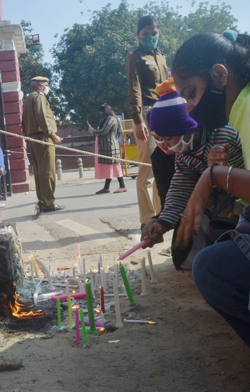 New Delhi: Christian devotees lighting the candles outside Sacred Heart Cathedral Church
