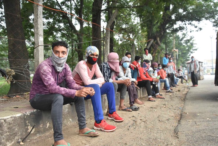 Labourers in safe place during rain and wind before cyclone Amphan