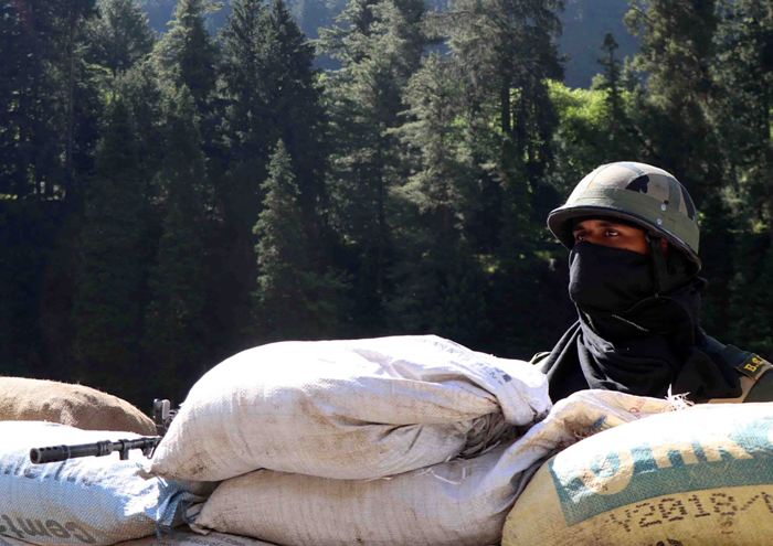 BSF soldiers guarding Indian troops moving to Galwan Valley in Ladakh on  Srinagar-Leh national highway 