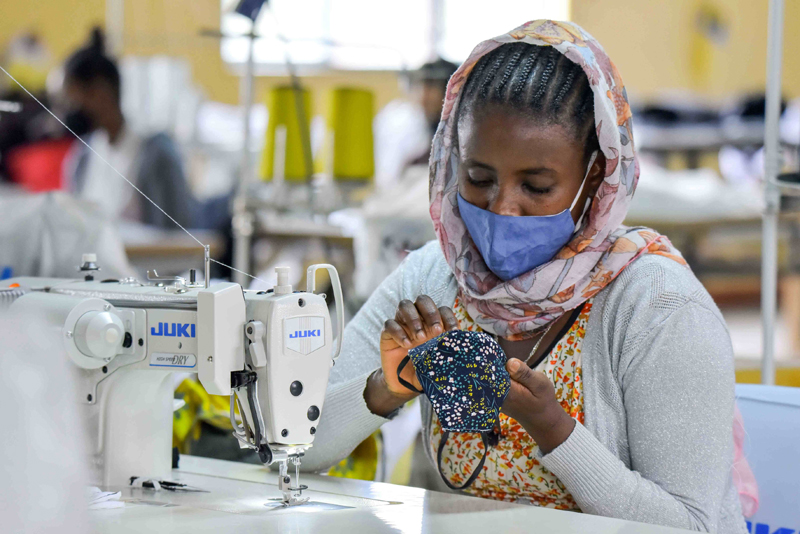View of woman making face mask at a firm in Ethiopia's Addis Ababa