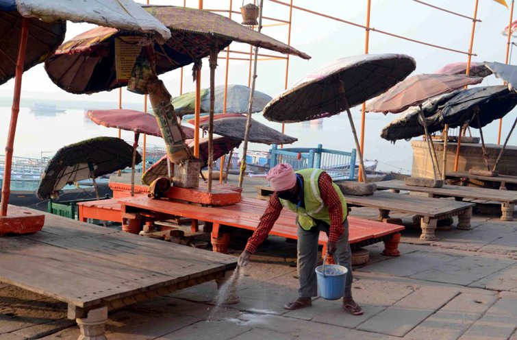 Woman offers obeisance to Ganges in locked down Varanasi