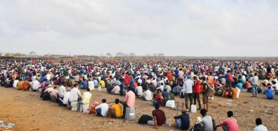 Migrants gather for medical check before boarding in Mumbai