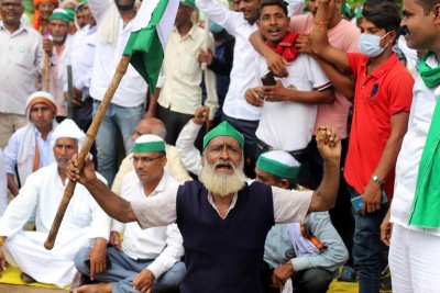 Prayagraj: Bharatiya Kishan Union workers block National Highway to protest against Farm Bills
