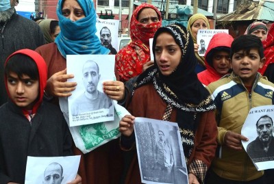 Family members of men arrested by Delhi Police protest in Srinagar