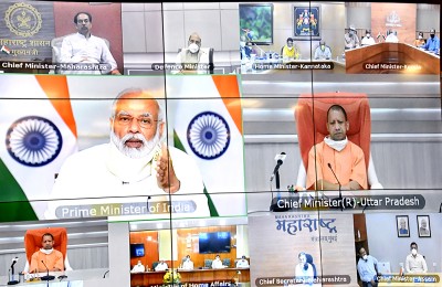 Prime Minister Narendra Modi interacing with Uttar Pradesh Chief Minister Yogi Aditiyanath