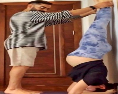 Pregnant Anushka Sharma does yoga with Virat Kohli's help