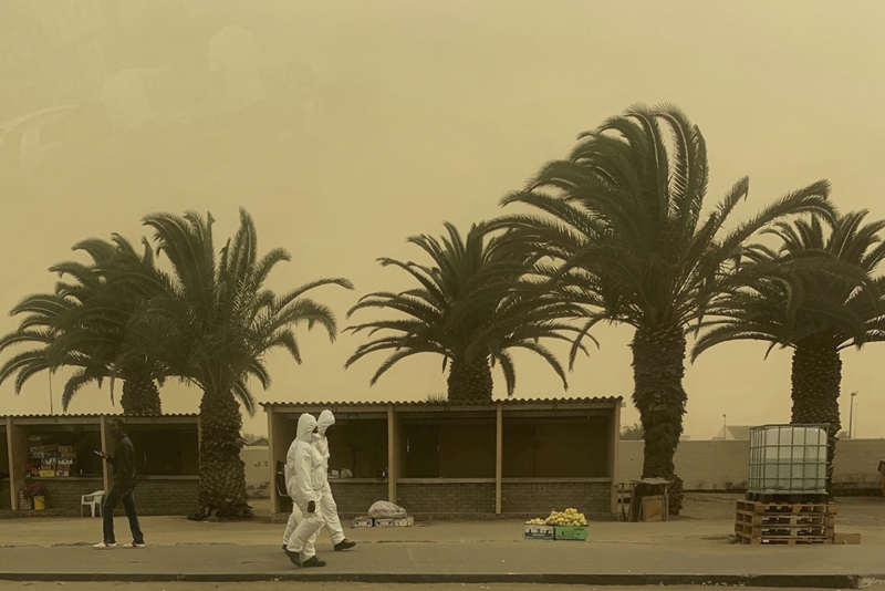 Namibia: Epidemic prevention personnel walk in sandstorm in Walvis Bay