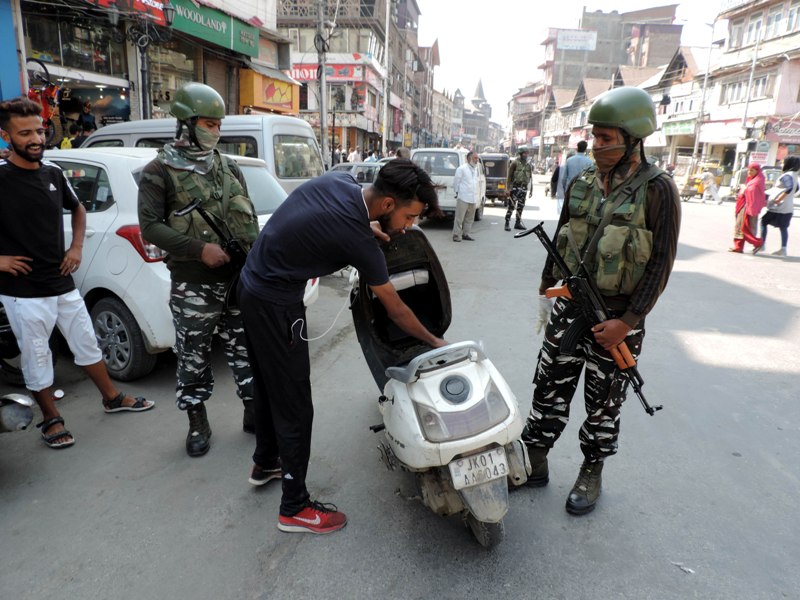 Srinagar: Security personnel checking vehicles at Lal Chowk