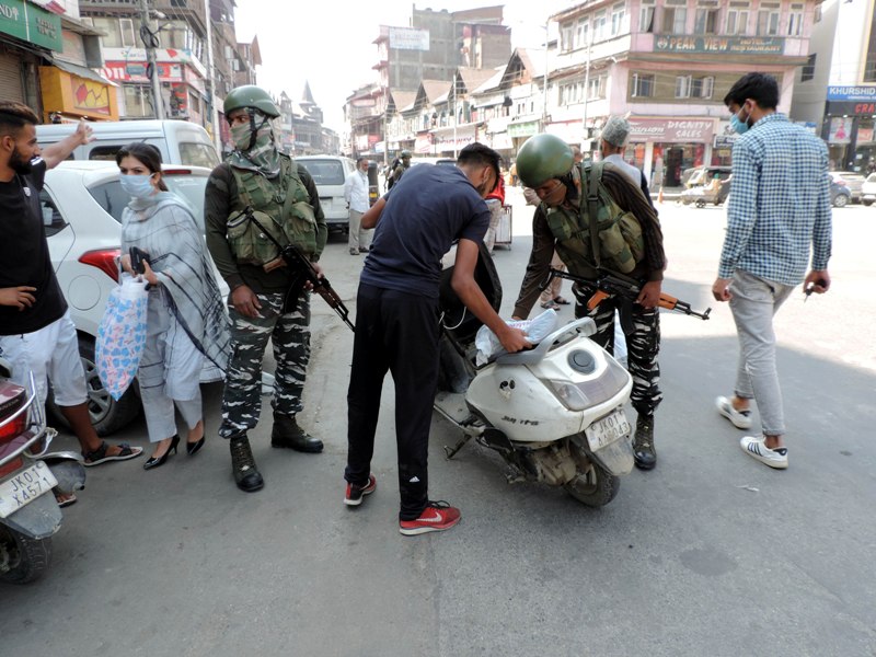 Srinagar: Security personnel checking vehicles at Lal Chowk