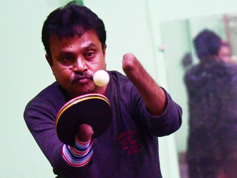 Disabled table tennis player Kajol Dey with his students on International Day of Persons with Disabilities in Agartala