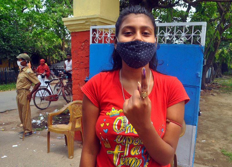 Voters waiting in queue at Thakurpukur polling station in Kolkata during Bengal Assembly Elections