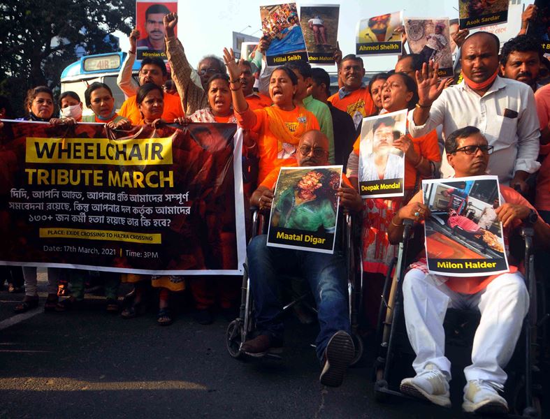 BJP workers in a 'Wheelchair Tribute March' attacking West Bengal CM Mamata Banerjee