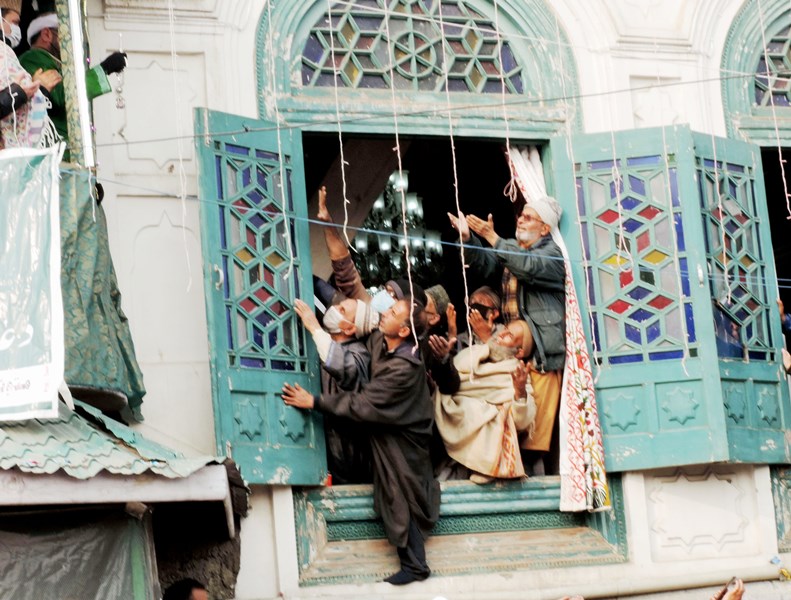 Devotees praying at Dastgeer Sahab shrine in J&K's Srinagar
