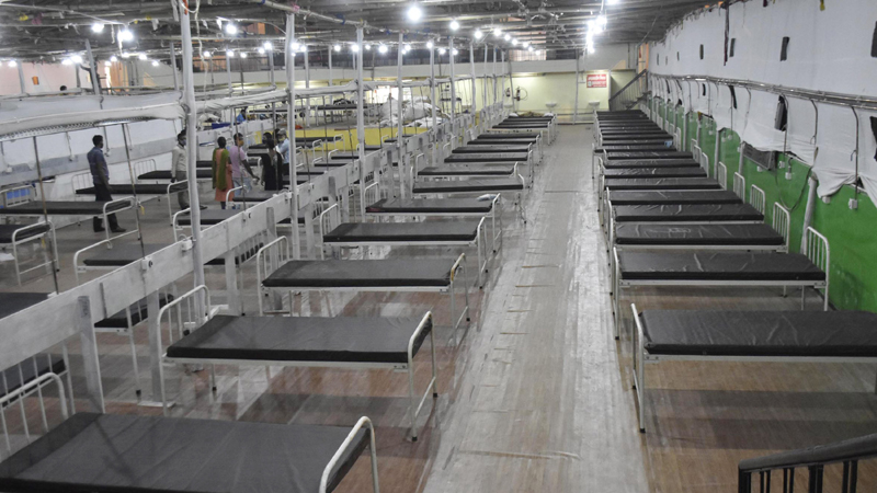 COVID-19: Worker prepares beds at Patliputra Sport Complex
