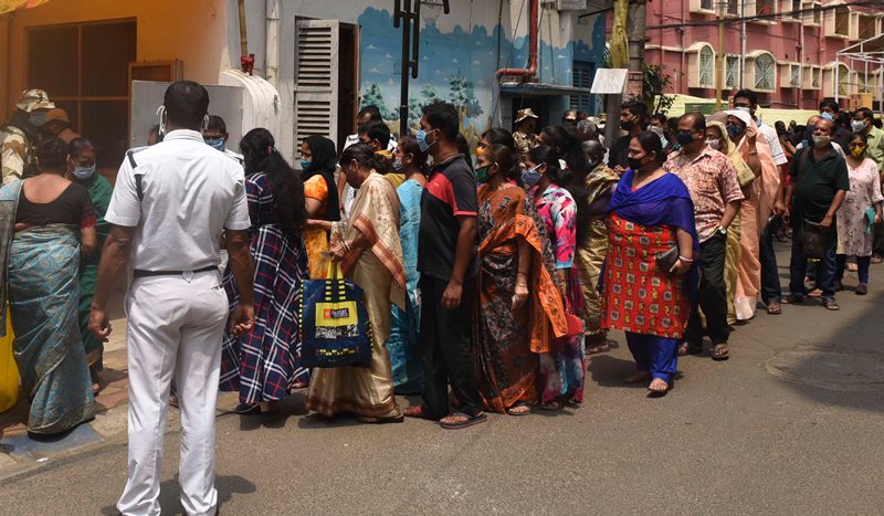 Voters waiting in queue at Thakurpukur polling station in Kolkata during Bengal Assembly Elections
