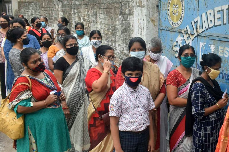 Voters waiting in queue at Thakurpukur polling station in Kolkata during Bengal Assembly Elections