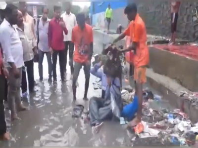 Shiv Sena MLA forces contractor to sit on waterlogged road, dumps garbage on him