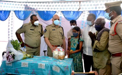 Adnan Nayeem Asmi distributing rice to 12-year-old girl