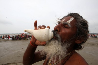 Sadhu praying after taking holy dip at Sangam in Prayagraj on Ganga Dussehra