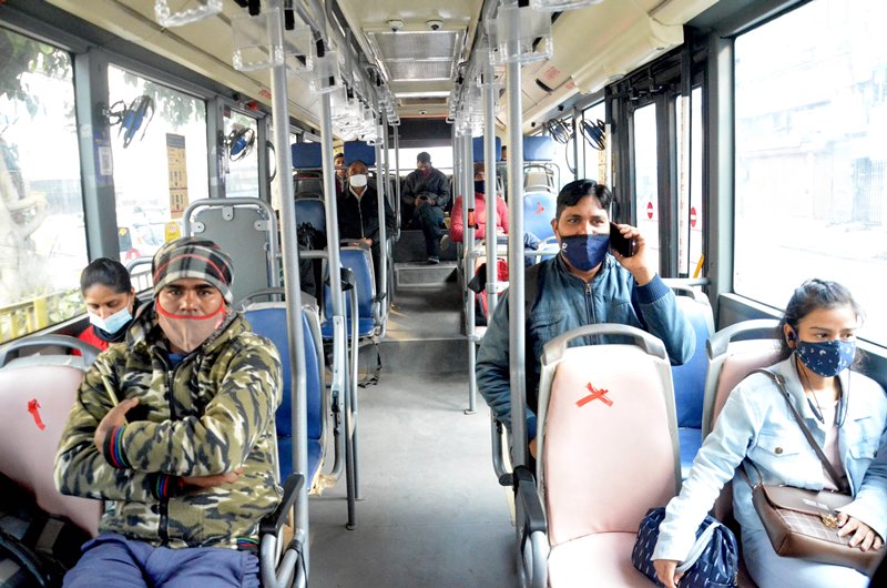 People travel amid COVID-19 spike in Delhi