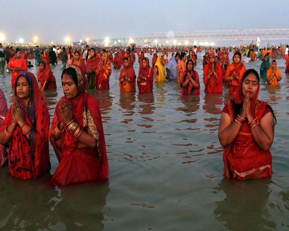 Chhat devotees paying obeisance to rising sun at the Ganges in Patna