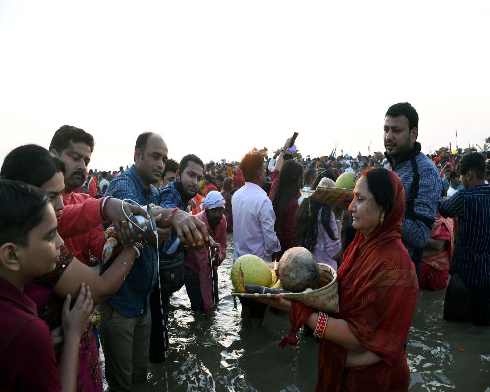 Chhat devotees paying obeisance to rising sun at the Ganges in Patna