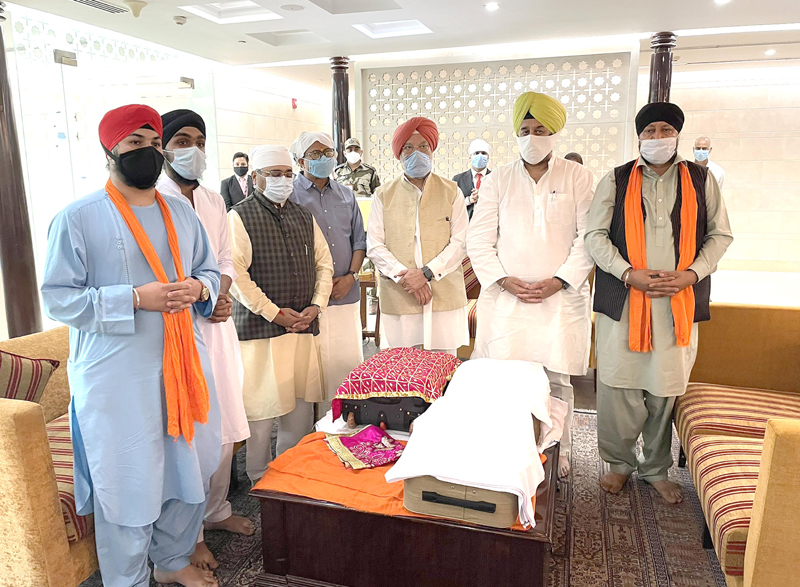 Hardeep Singh Puri receiving Sri Guru Granth Sahib