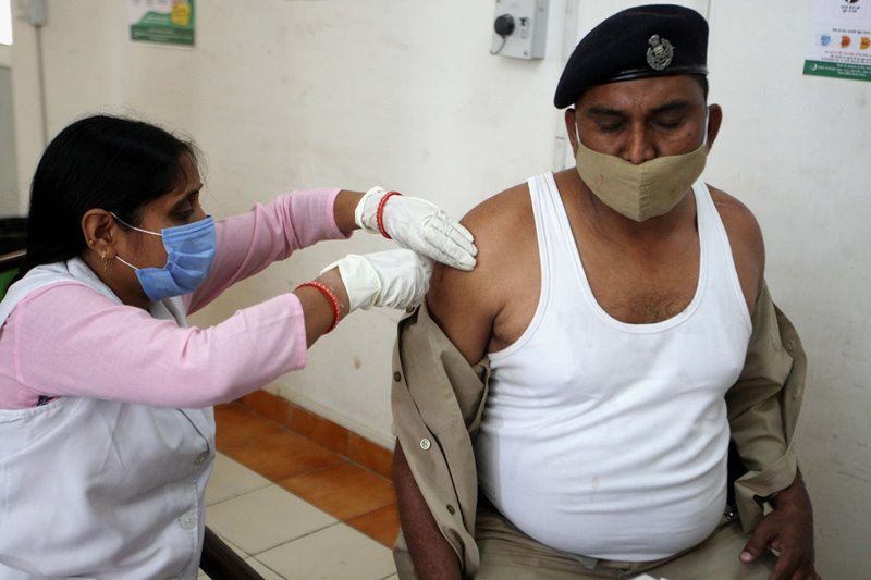 Officer receiving COVID-19 vaccine in Prayagraj