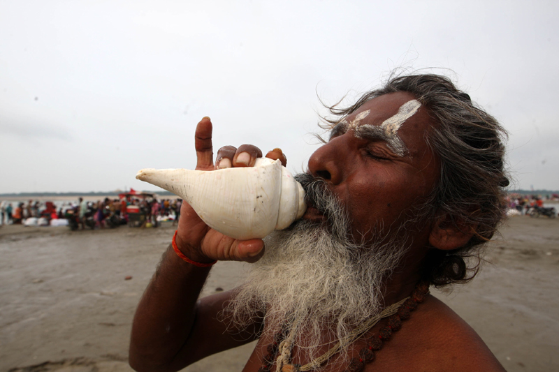 Sadhu praying after taking holy dip at Sangam in Prayagraj on Ganga Dussehra
