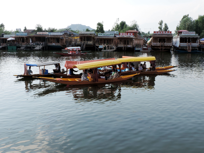 Tourists taking a shikara ride in Srinagar's Dal Lake