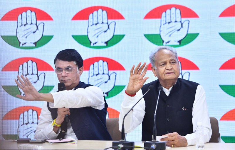 Rajasthan CM Ashok Gehlot addresses a press conference with Cong leader Pawan Khera
