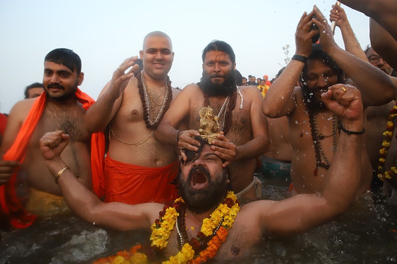 Maha Kumbh 2025: Naga sadhus steal the show on Triveni bank