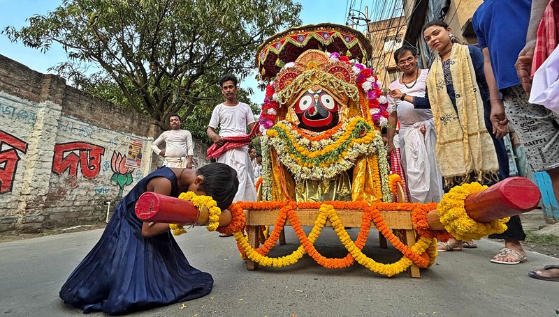 In Images: Devotees perform in north Kolkata as they proceed to fetch holy water for Jagannath Snan Yatra